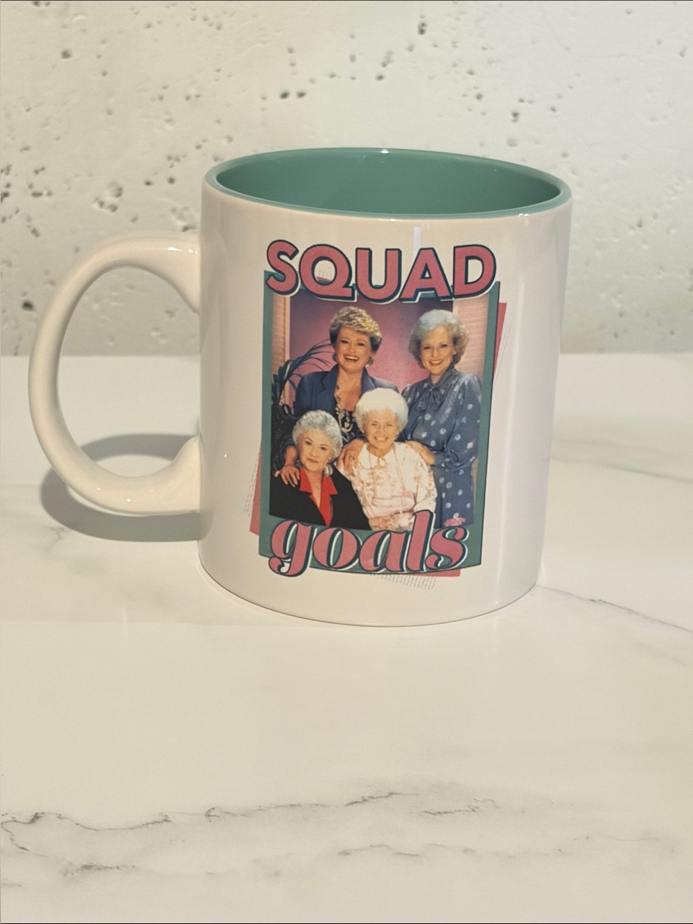 White Ceramic Mug with Teal Interior and 'Squad Goals' Graphic